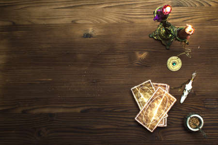 Tarot cards on wooden table. Fortune teller table.の写真素材