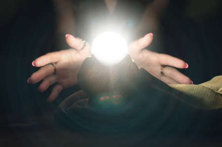 Crystal ball and fortune teller hands. Divination. Seance.の写真素材