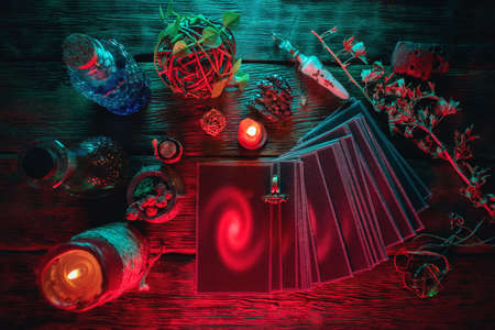 Tarot cards deck on the old table background.の写真素材