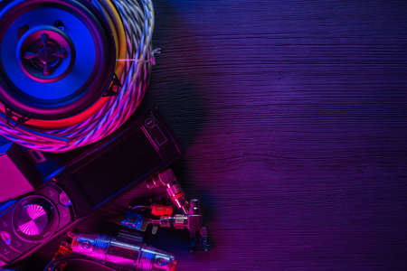 A car audio equipment on the table in the neon lights background.の写真素材