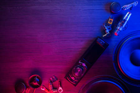 A car audio equipment on the table in the neon lights background.の写真素材