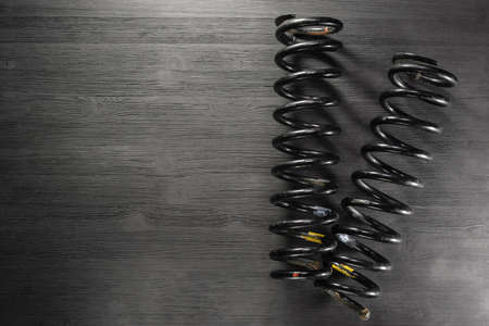 A car coil springs on the workbench background with copy space.の写真素材