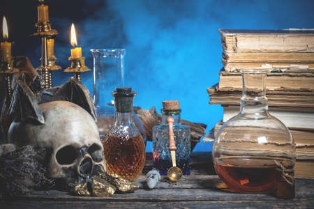 Magic potions on the alchemist table background.の写真素材