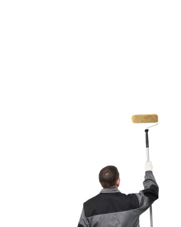 House painter is painting a wall by paint roller.の写真素材