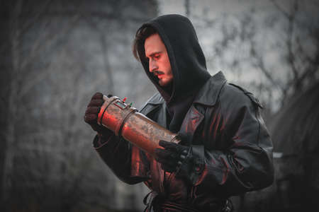 Post apocalypse soldier with a artefact container in the hands concept.