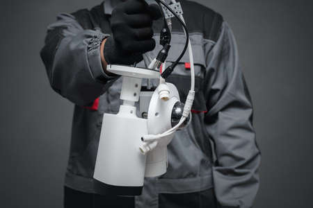 Security cameras in the technician hand close up.