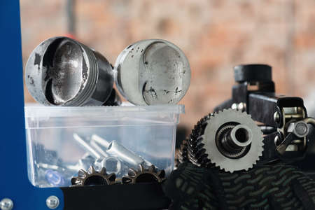 An old car spare parts on the workbench close up background.の写真素材