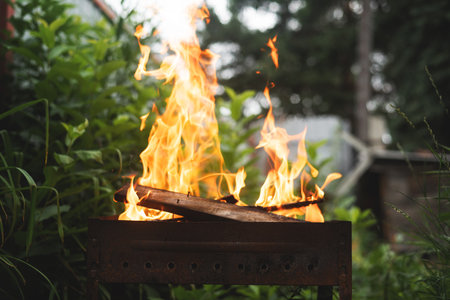Brazier with burning fire within close up background.の写真素材