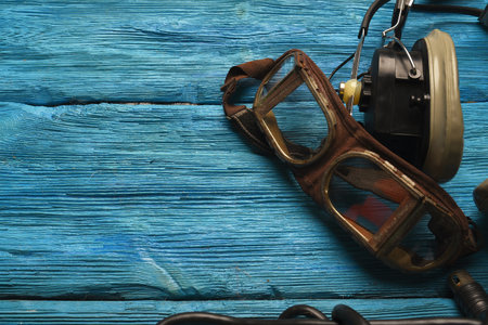 Retro style pilot goggles and headset on the blue sky concet background with copy space.の写真素材