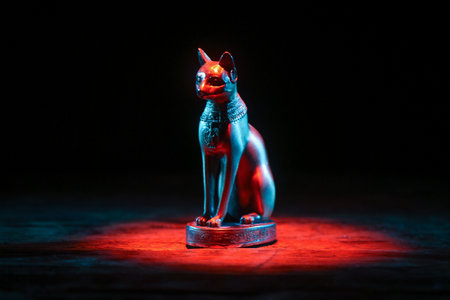 Ancient Egyptian goddess Bast (Bastet) silhouette in the lights close up.の写真素材