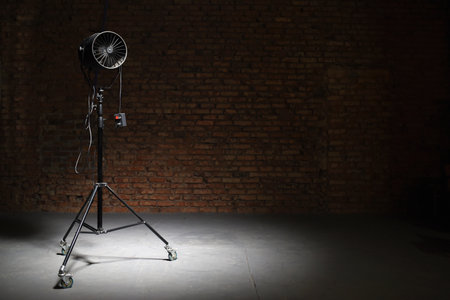 Axial photostudio fan on the brick wall background. Photo studio equipment.の写真素材