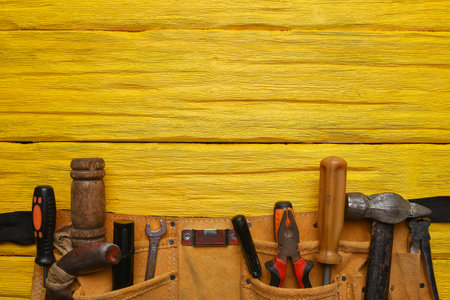 Construction concept background. Building work tool on the wooden workbench background. Top view. Flat lay.の写真素材