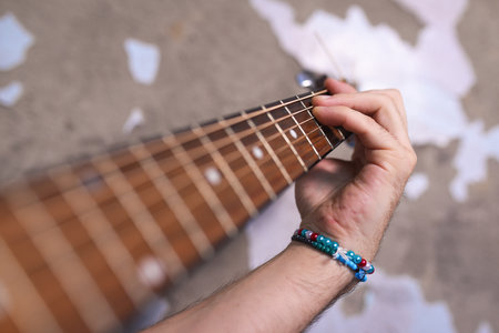 Man playing acoustic guitar close up.の写真素材