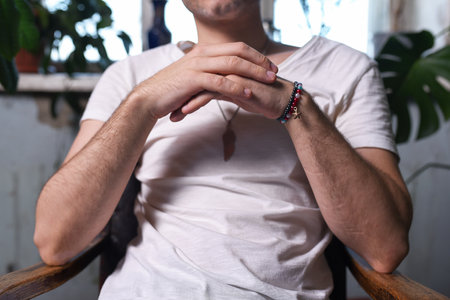 Man sits with crossed arms on the chair. Reception. Job interview.の写真素材