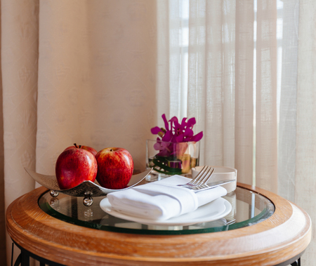 still life with apples and cutlery on the tableの写真素材