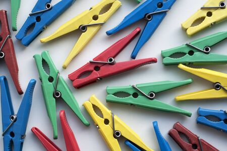 Colored clothespins on a white background shot close-upの写真素材