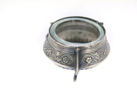 Old mustard-pot on the white backgroundの写真素材