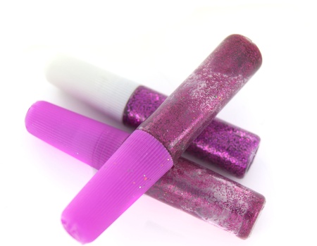 Three purple glitter tubes on whiteの写真素材