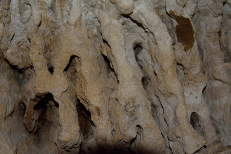 Stalactites on the wall of the cave 