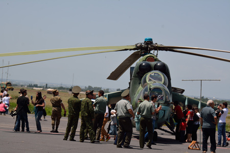 People watcjhing at the helicopter in the airport of Erebuni, Armeniaのeditorial素材