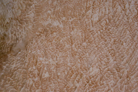Travertin surface peach and white closeupの写真素材