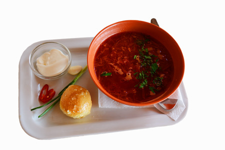 Borsch - traditional Ukrainian vegetable soup served with sourr cream, garlic bread, greenery, hot pepper and garlicの写真素材