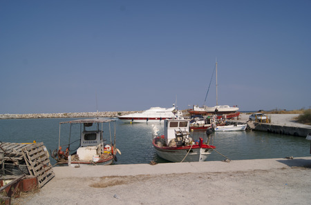 Summer harbour in the Greek village with the small shipsのeditorial素材