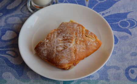 A piece of cherry pie pastry on the plate