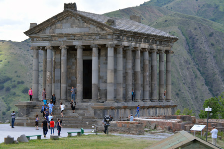 Garni temple with the tourists walking nearby in the summer dayのeditorial素材