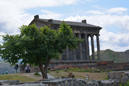 Garni temple behind the tree in Armenia with the touristsのeditorial素材