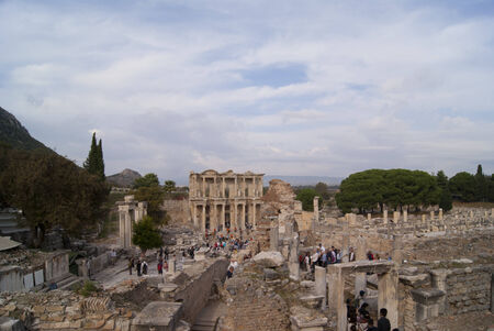 The ruins of the street in Ephesus and the nearby buildings, with groups of tourists visitingのeditorial素材