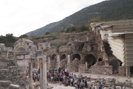 The street in Ephesus with the tourists and the restoration tents on the hillのeditorial素材