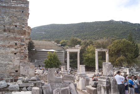 Two archs on the Ephesus street, Turkey, with touristsのeditorial素材