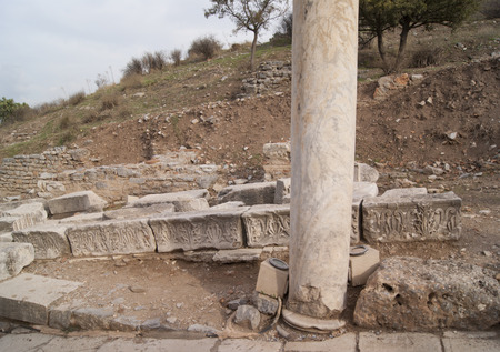 The marble column and the remnants of the facade in Ephesus, Turkeyの写真素材