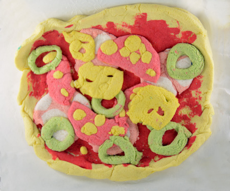 Salt dough pizza - child craft of colored salt doughの写真素材