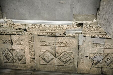 Carved stones on the walls of Geghard monastery, Armenia