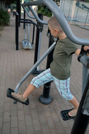 A boy on the outdoor fitness trainingの写真素材