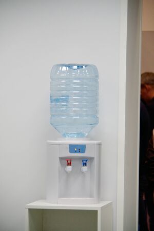 water cooler with a bottle on the tableの写真素材