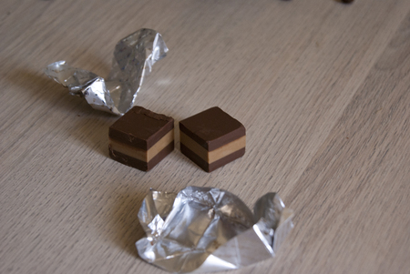 two square chocolates without the foilの写真素材