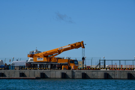 SOCHI, RUSSIA: 29.09.2014 - HYDRAULIC MOBILE CRANE WORKING IN A PIER