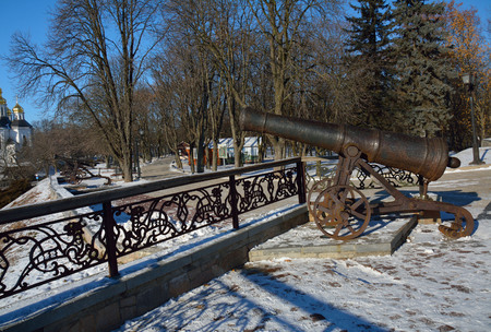 CHERNIHIV/UKRAINE - JANUARY 08 2015: alley in the Val park, with the cannon, St. Catherine church and the cafe in the farの写真素材