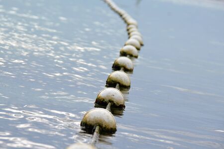 float border on sea water, side viewの写真素材