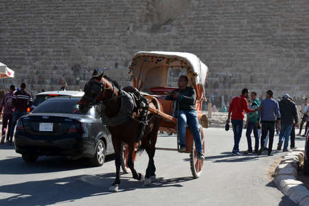 GIZA/EGYPT - NOVEMBER 30, 2018: man with a horse carriage in the street, emptyのeditorial素材