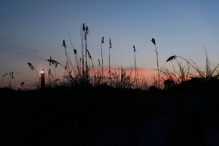 Lighthouse Sunset at Ponce Inlet Harborの写真素材