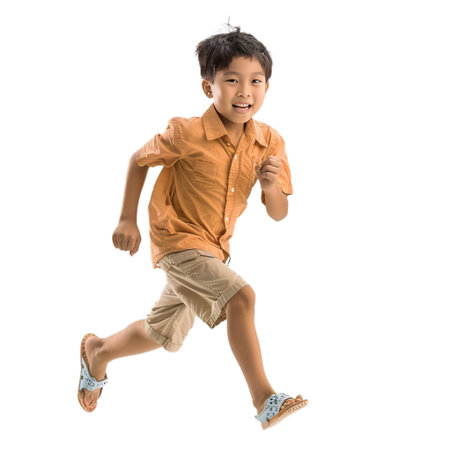Cutout of a cheerful young boy captured mid jump with a bright smile, isolated on a transparent backgroundの素材
