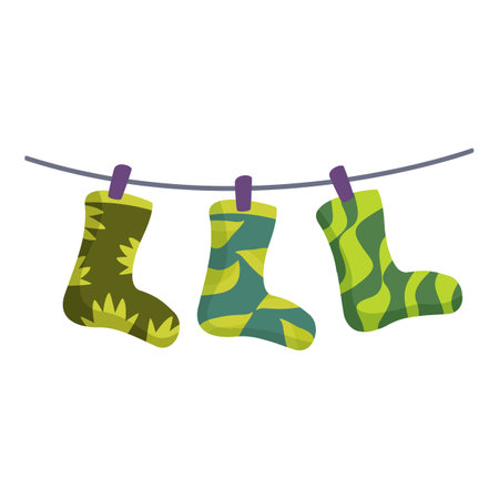 Three colorful socks are hanging on a clothesline to dry after being washed