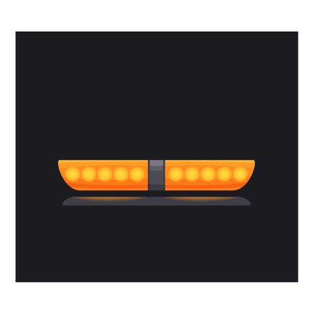 Orange emergency flashing siren light reflecting on a surface