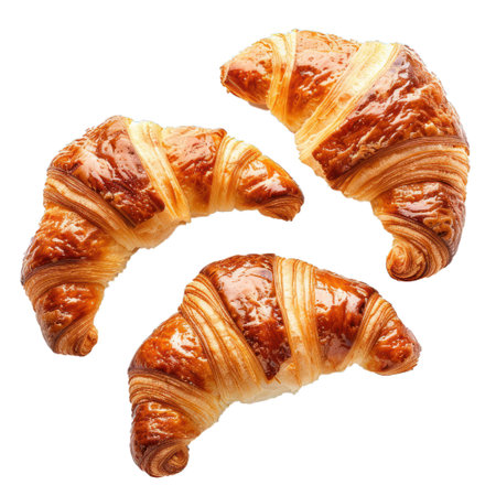 Three delicious croissants with a golden crust are lying on a white backgroundの素材