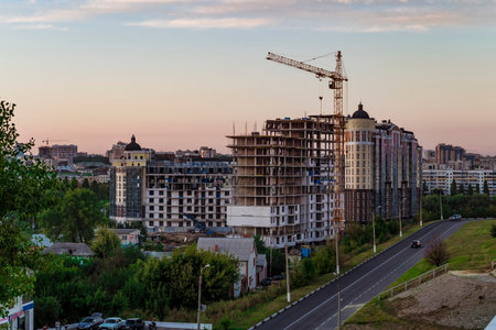 BELGOROD, RUSSIA - SEPTEMBER 10, 2016: Housing construction in the Belgorod city. The construction of the residential complex "Paris". Evening construction site.のeditorial素材