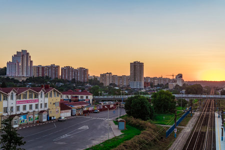BELGOROD, RUSSIA - SEPTEMBER 10, 2016: Railway tracks in the direction of the border with Ukraine. Street Market "Salute". Evening skyline of the Belgorod city.のeditorial素材